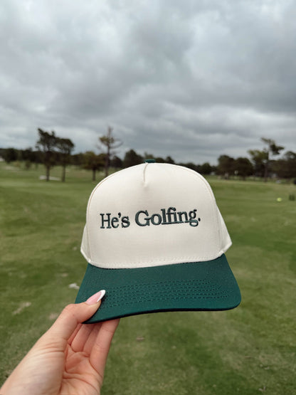 He's Golfing - Green Vintage Trucker Hat